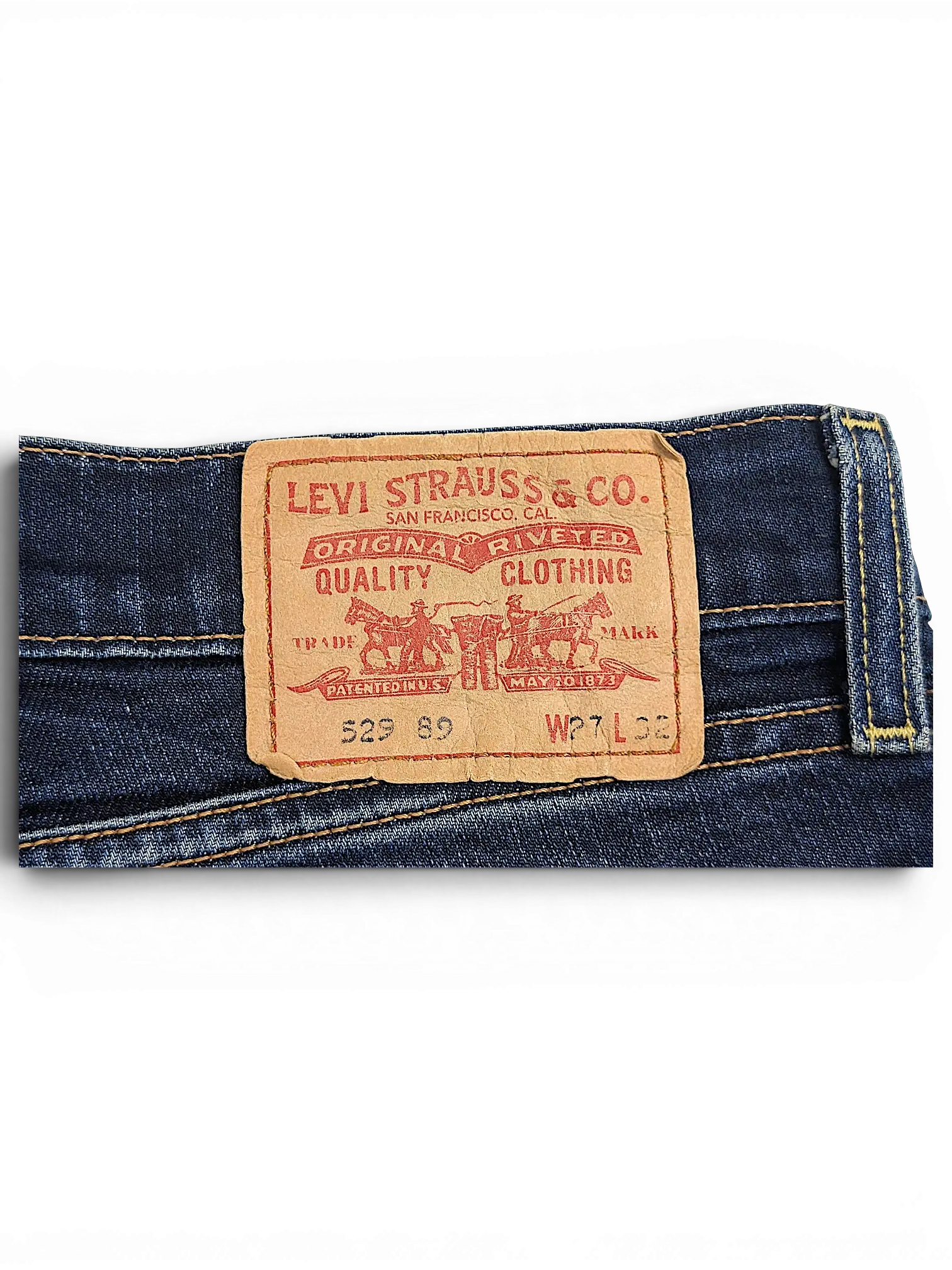 JAKE & IPI Levi's 529 89 bootcut jeans featuring a classic tan leather brand patch on dark blue denim fabric