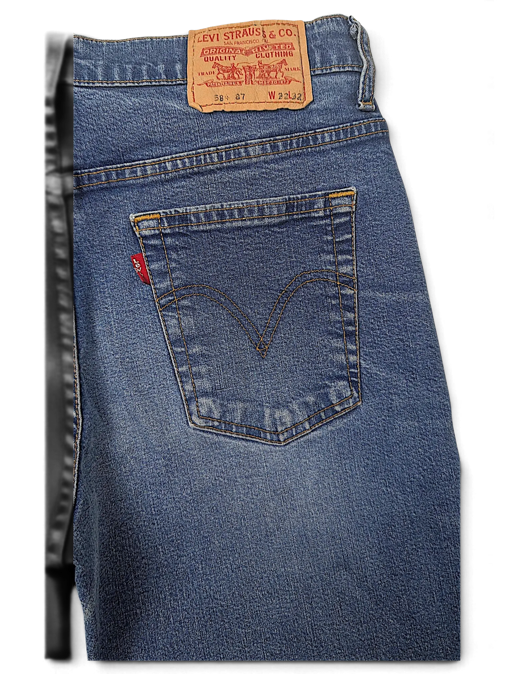 JAKE & IPI Levi's 584 87 blue denim jeans featuring a classic back pocket with red tab and leather brand patch.