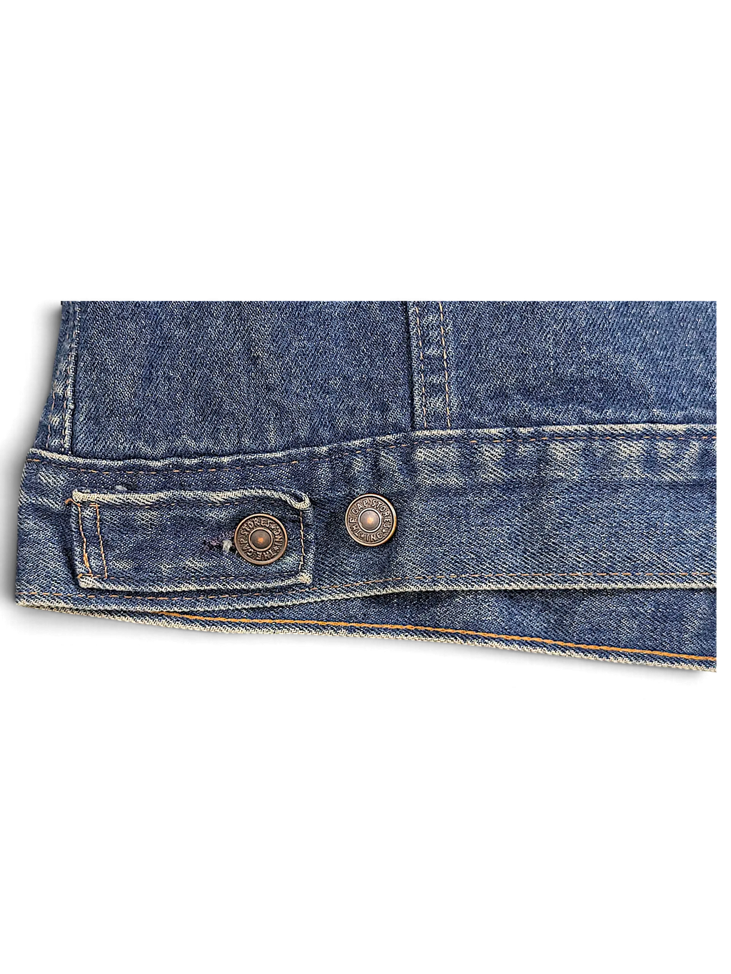 JAKE & IPI vintage Levi's denim jacket hem detail featuring blue cotton fabric and branded metal buttons