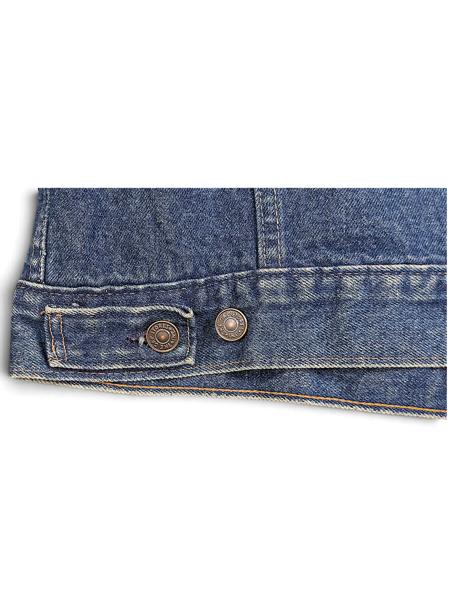 JAKE & IPI vintage Levi's denim jacket hem detail featuring blue cotton fabric and branded metal buttons