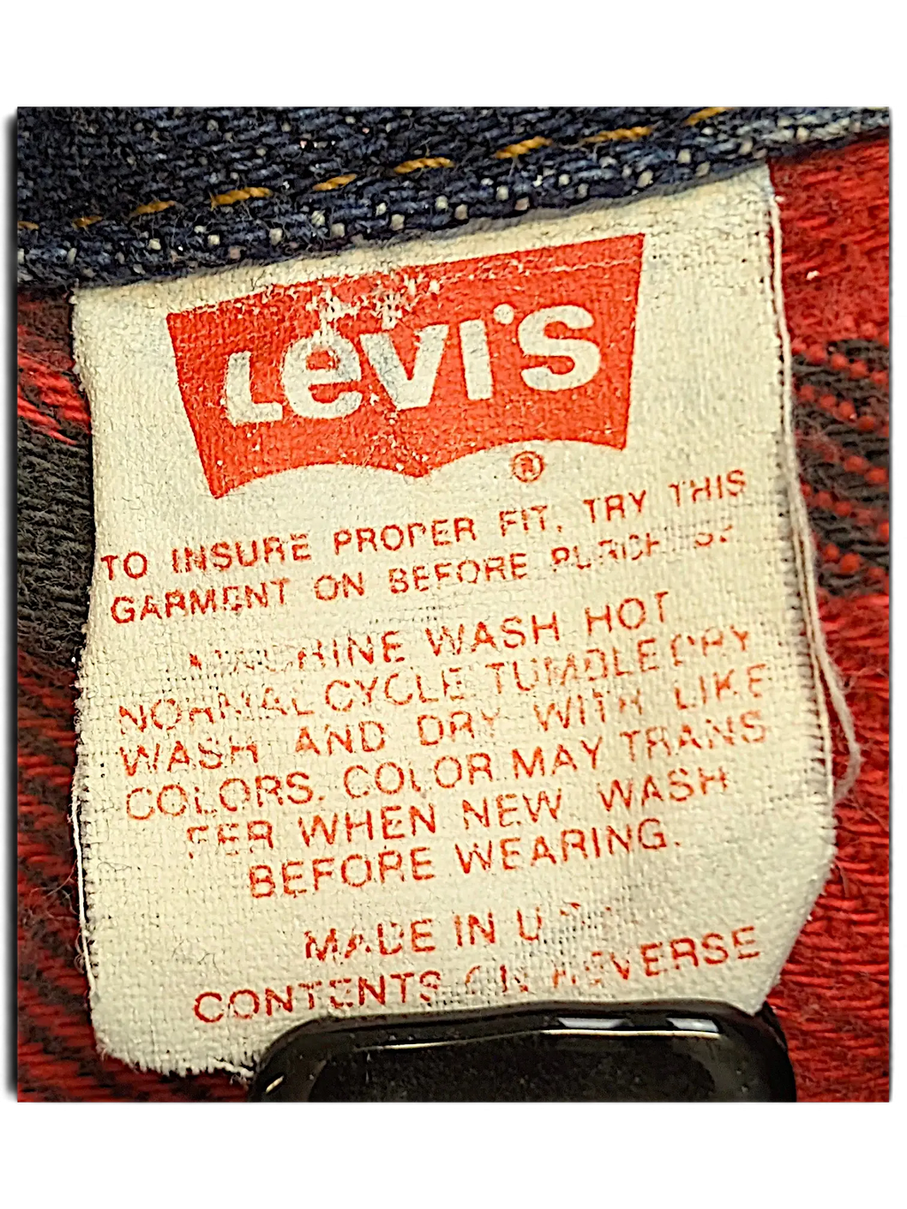 JAKE & IPI vintage Levi's denim jacket care label with red and black plaid quilted lining detail