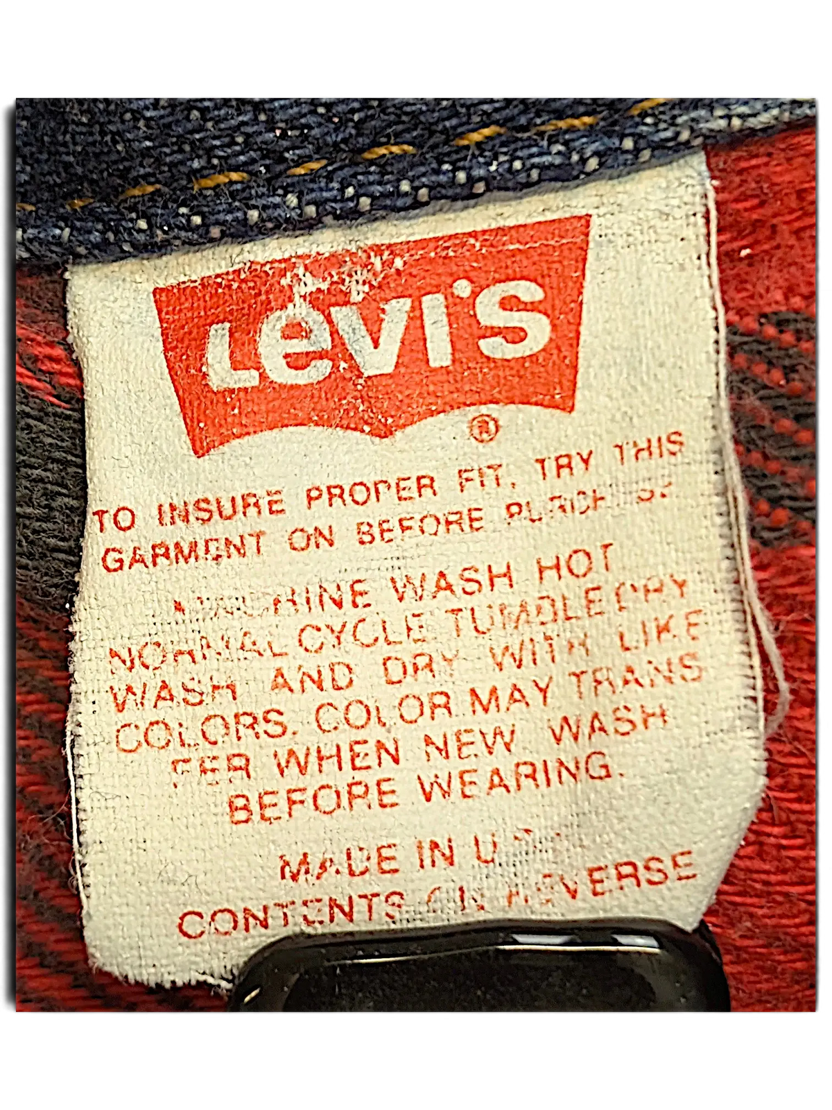 JAKE & IPI vintage Levi's denim jacket care label with red and black plaid quilted lining detail