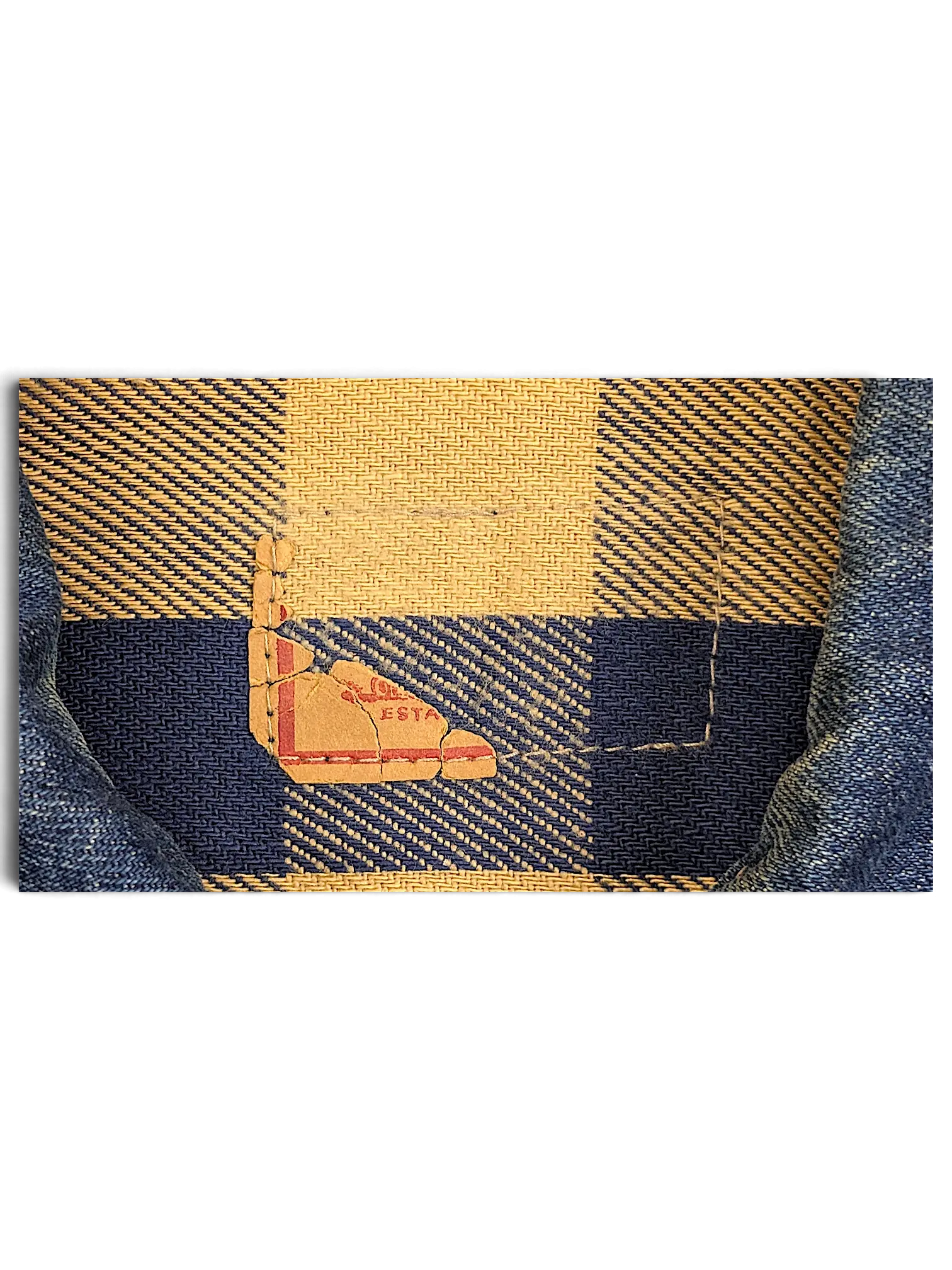JAKE & IPI vintage Levi's denim jacket interior featuring a blue and cream plaid flannel lining and a worn label tag