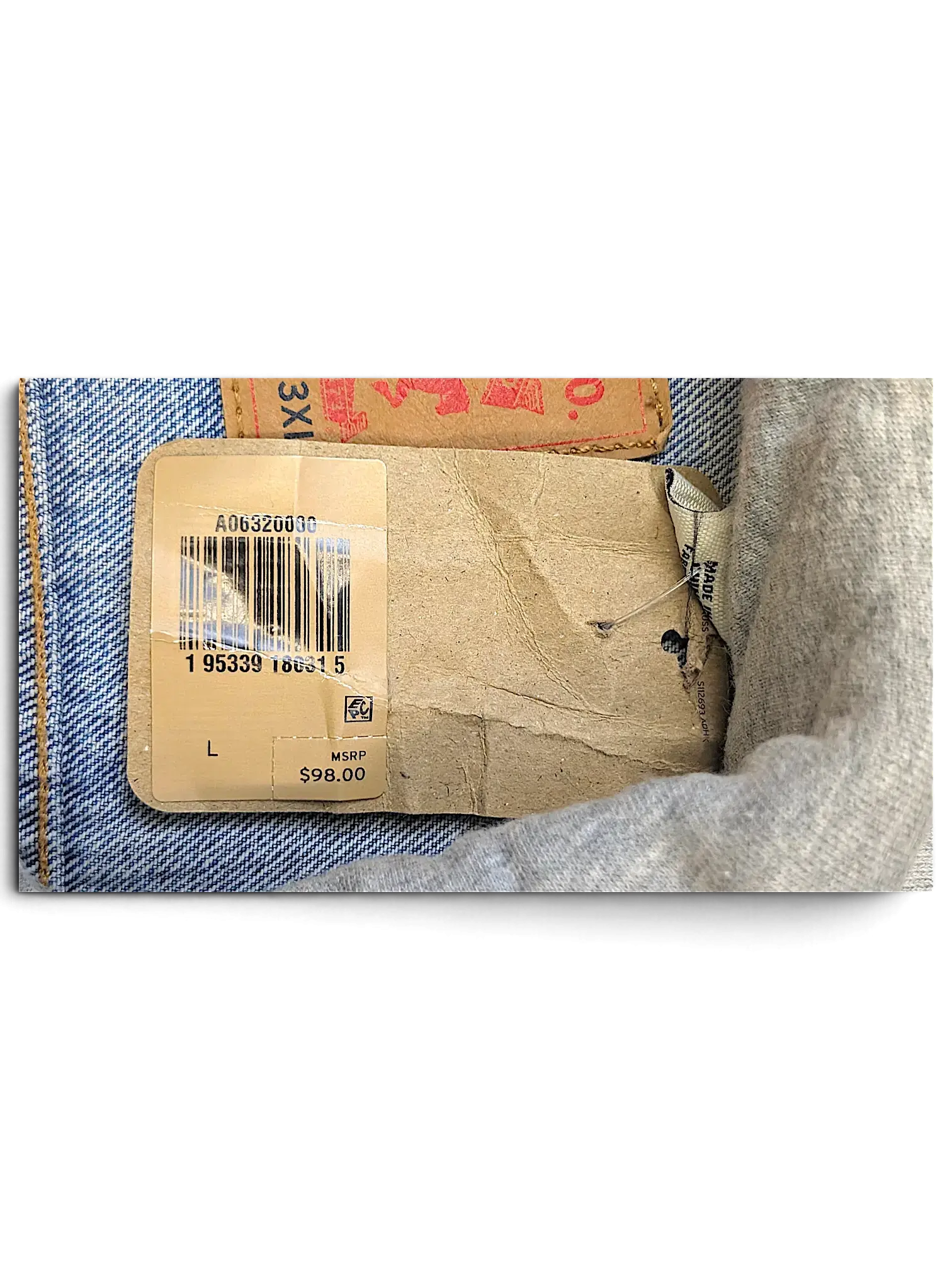 JAKE & IPI Levi's denim jacket cardboard product tag with barcode and size L label