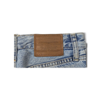 JAKE & IPI Levi's light wash denim jeans featuring a classic brown leather brand patch on the back waistband