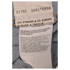 JAKE & IPI Levi's denim shirt care label with fabric composition and washing instructions in multiple languages