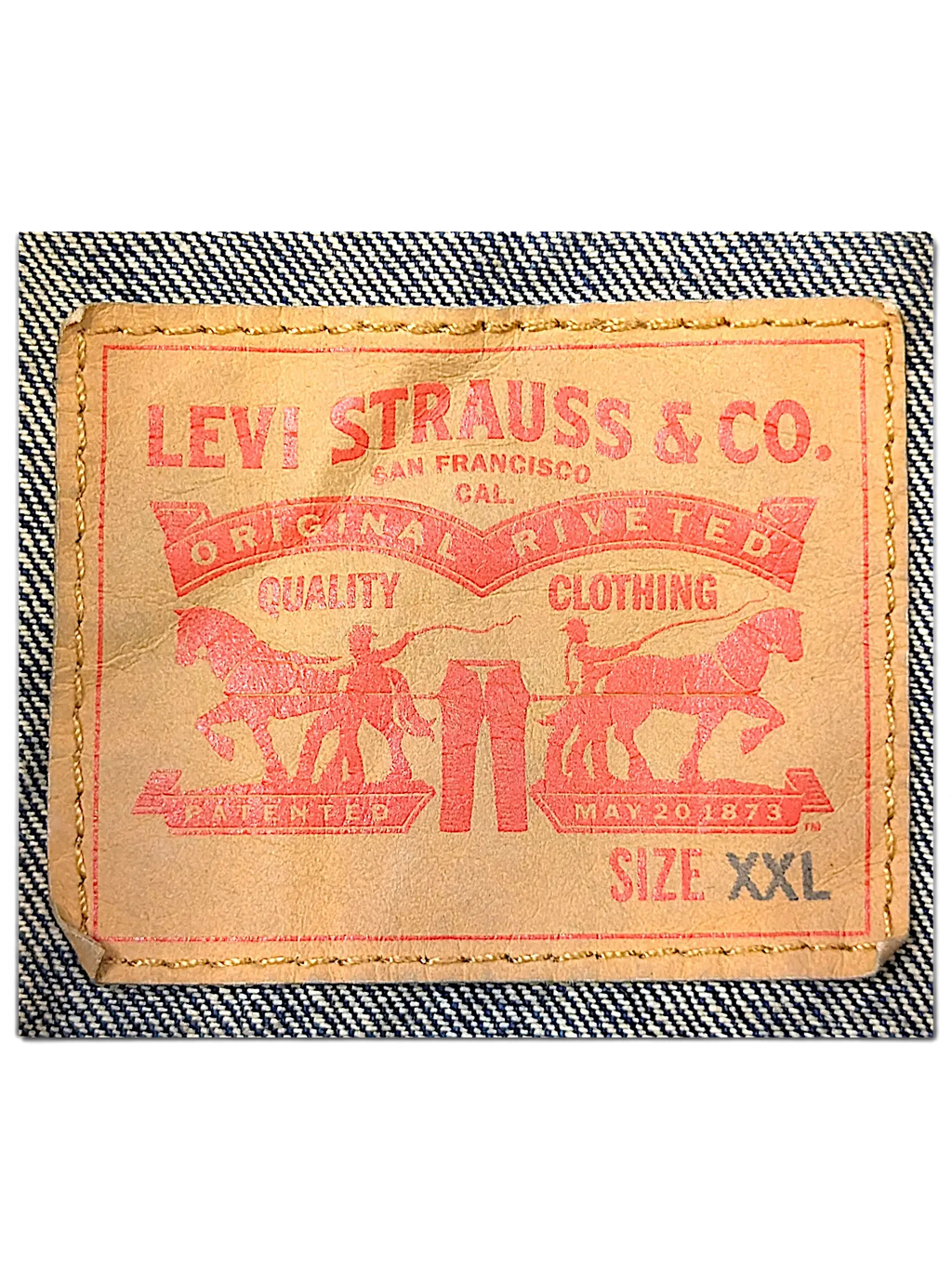 JAKE & IPI Levi's denim vest tan leather brand patch with red logo and size XXL label stitched on blue denim fabric