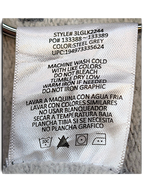 JAKE & IPI Levi's hoodie care label in steel grey with washing instructions in English and Spanish