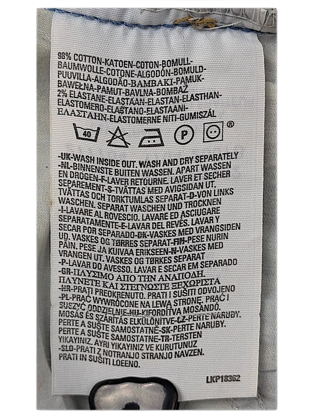 JAKE & IPI Levi's 584 jeans care label showing 98% cotton and 2% elastane fabric composition and washing instructions.