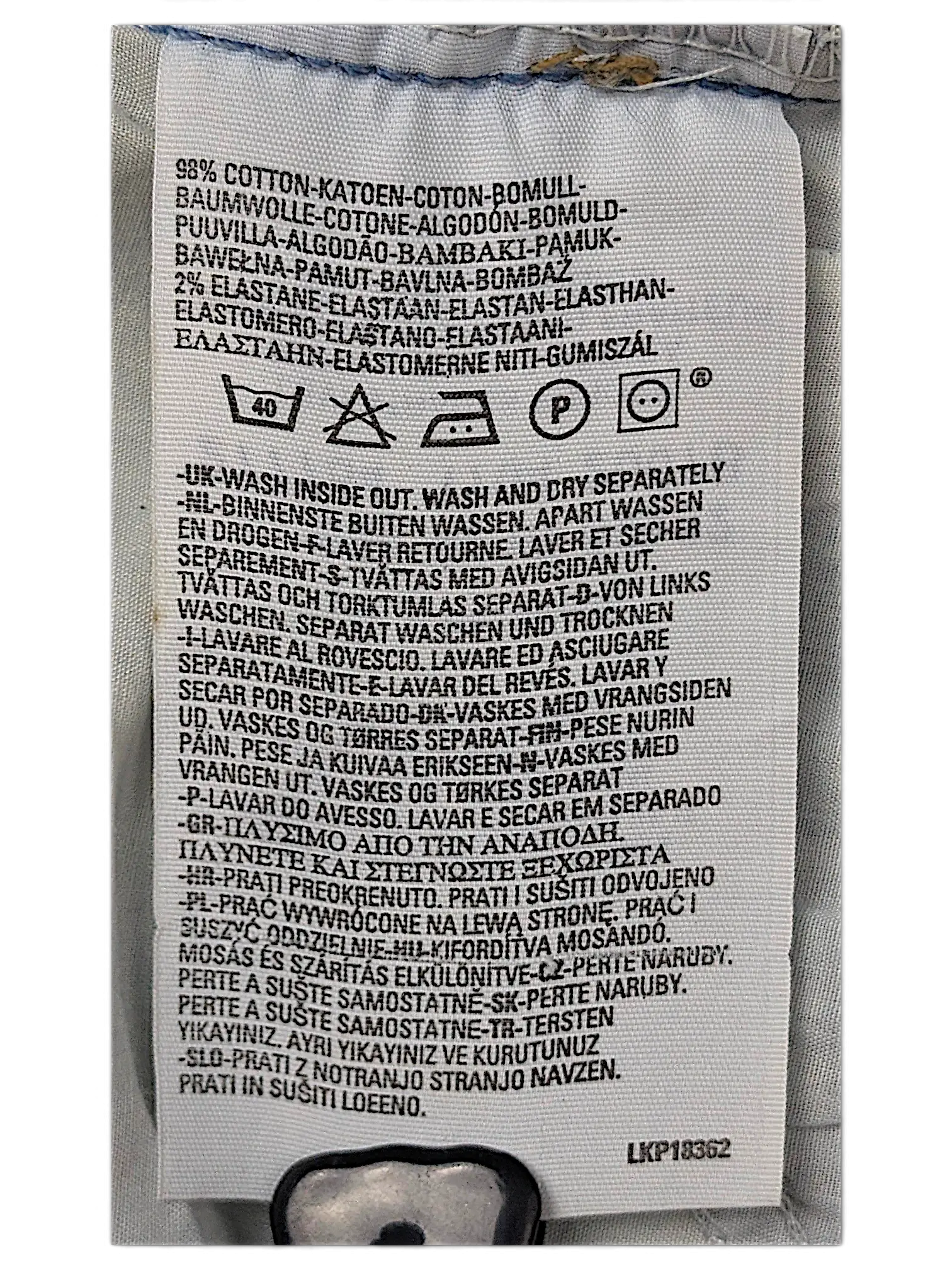 JAKE & IPI Levi's 584 jeans care label showing 98% cotton and 2% elastane fabric composition and washing instructions.