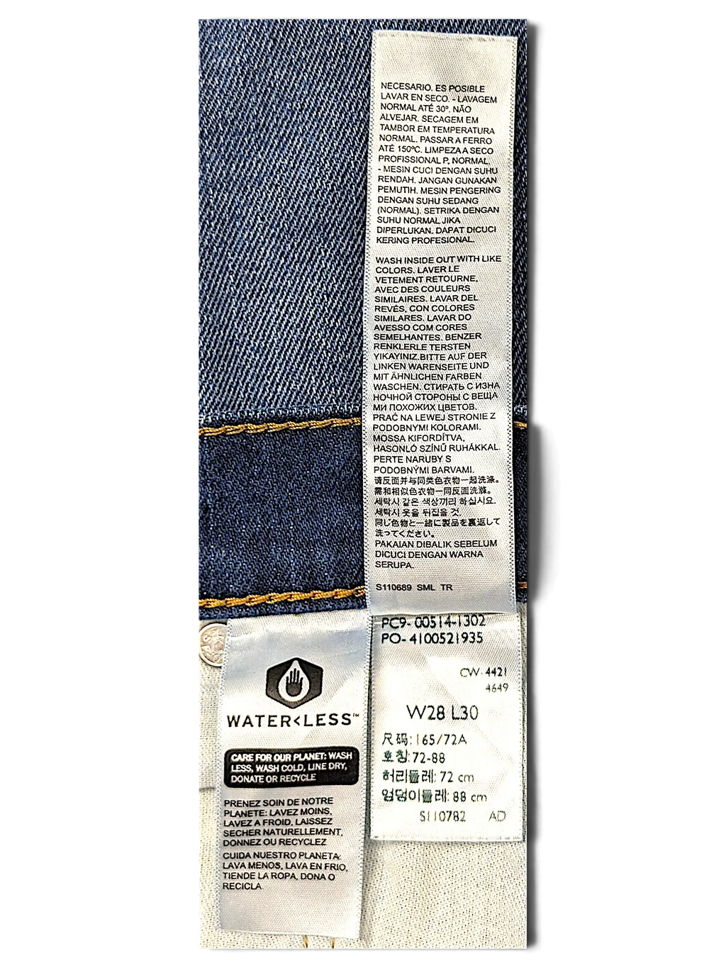 JAKE & IPI Levi's 514 jeans inner care label showing size W28 L30 and Water<Less technology branding