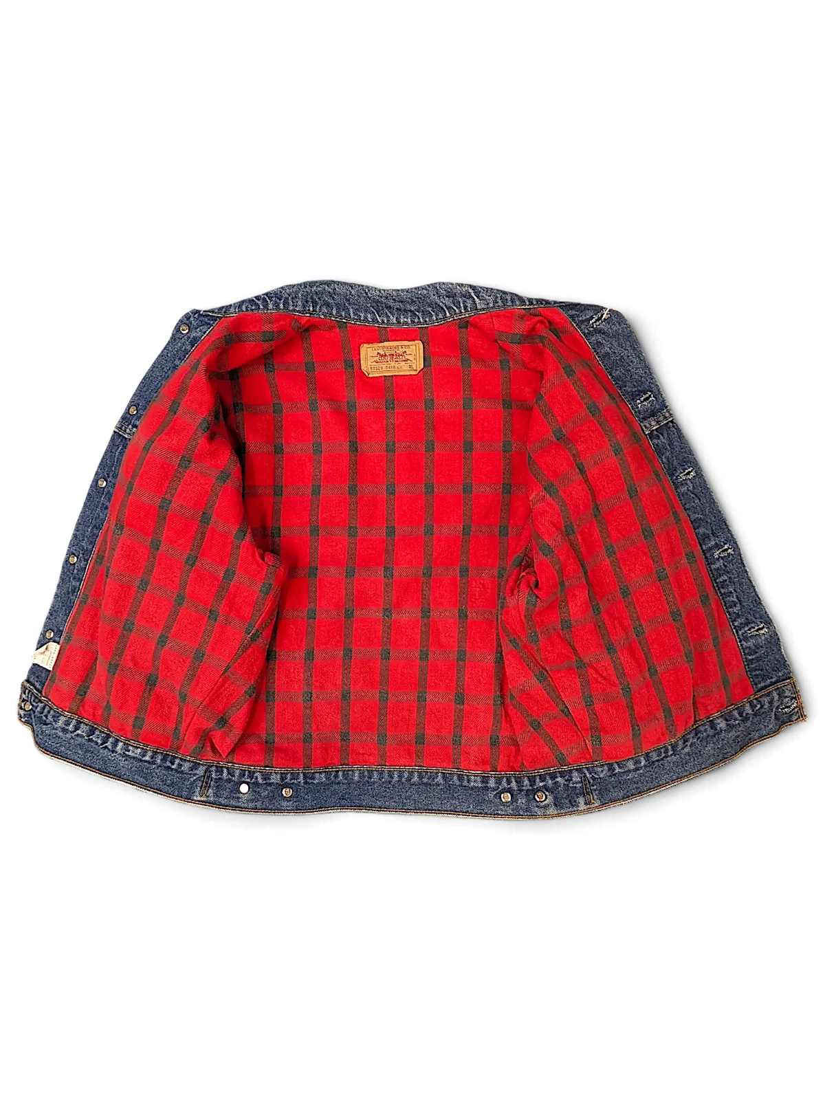JAKE & IPI Levi's denim jacket featuring a vibrant red and black plaid quilted interior lining