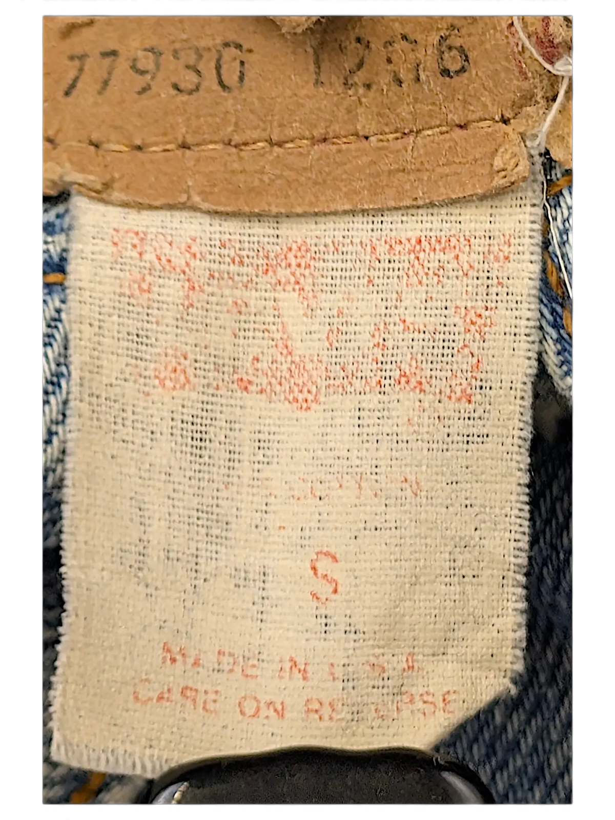 JAKE & IPI vintage Levi's denim jacket tag with size S label and Made in USA text on light blue denim fabric