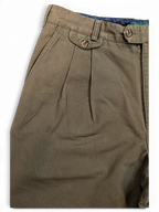 JAKE & IPI Liberty vintage olive green pleated trousers with a buttoned front pocket and plaid waistband lining.