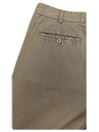 JAKE & IPI Liberty vintage olive green pleated trousers featuring a rear welt pocket with a button detail.