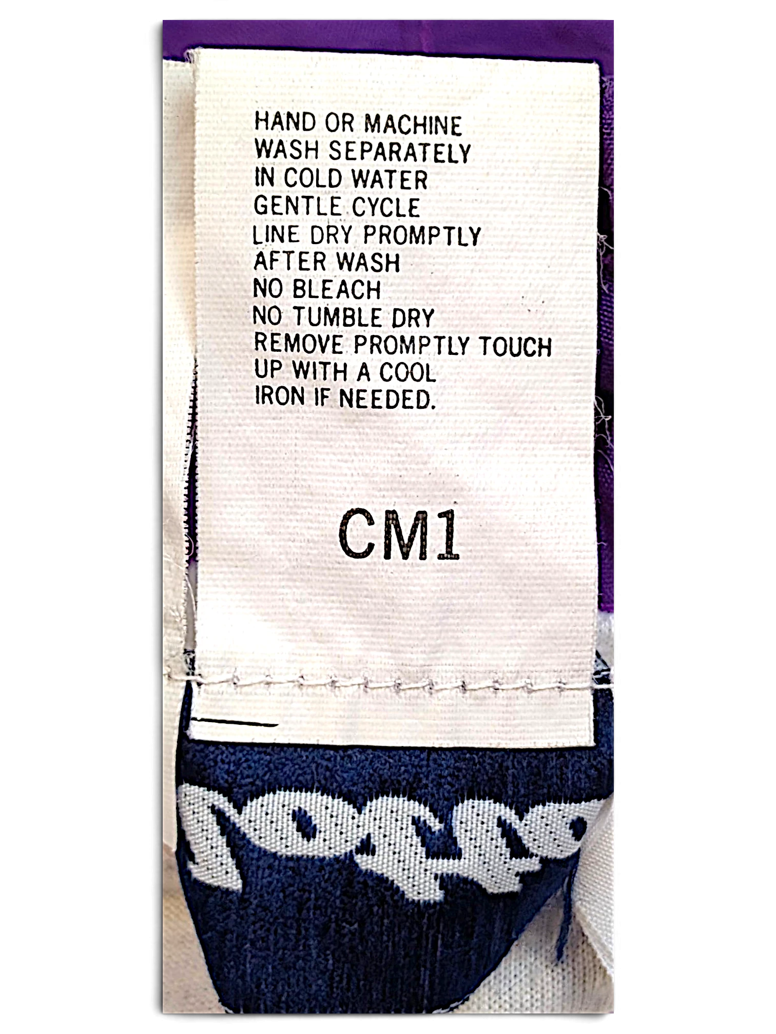 JAKE & IPI Lotto track pants care label with washing instructions and branding detail