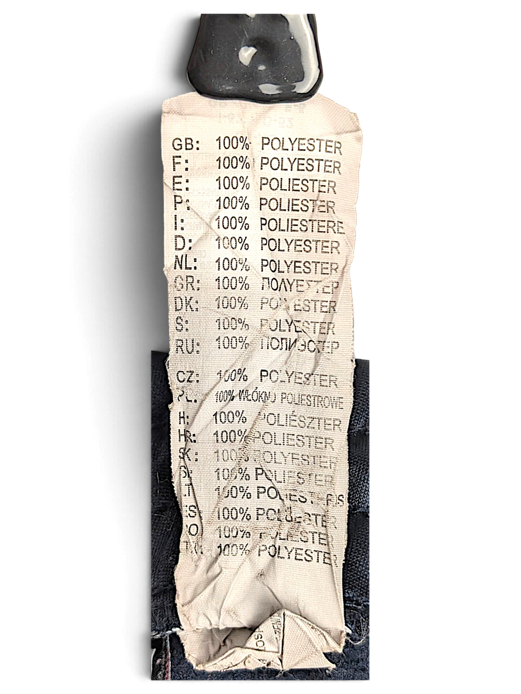 JAKE & IPI Lotto track pants care label showing 100 percent polyester composition in multiple languages