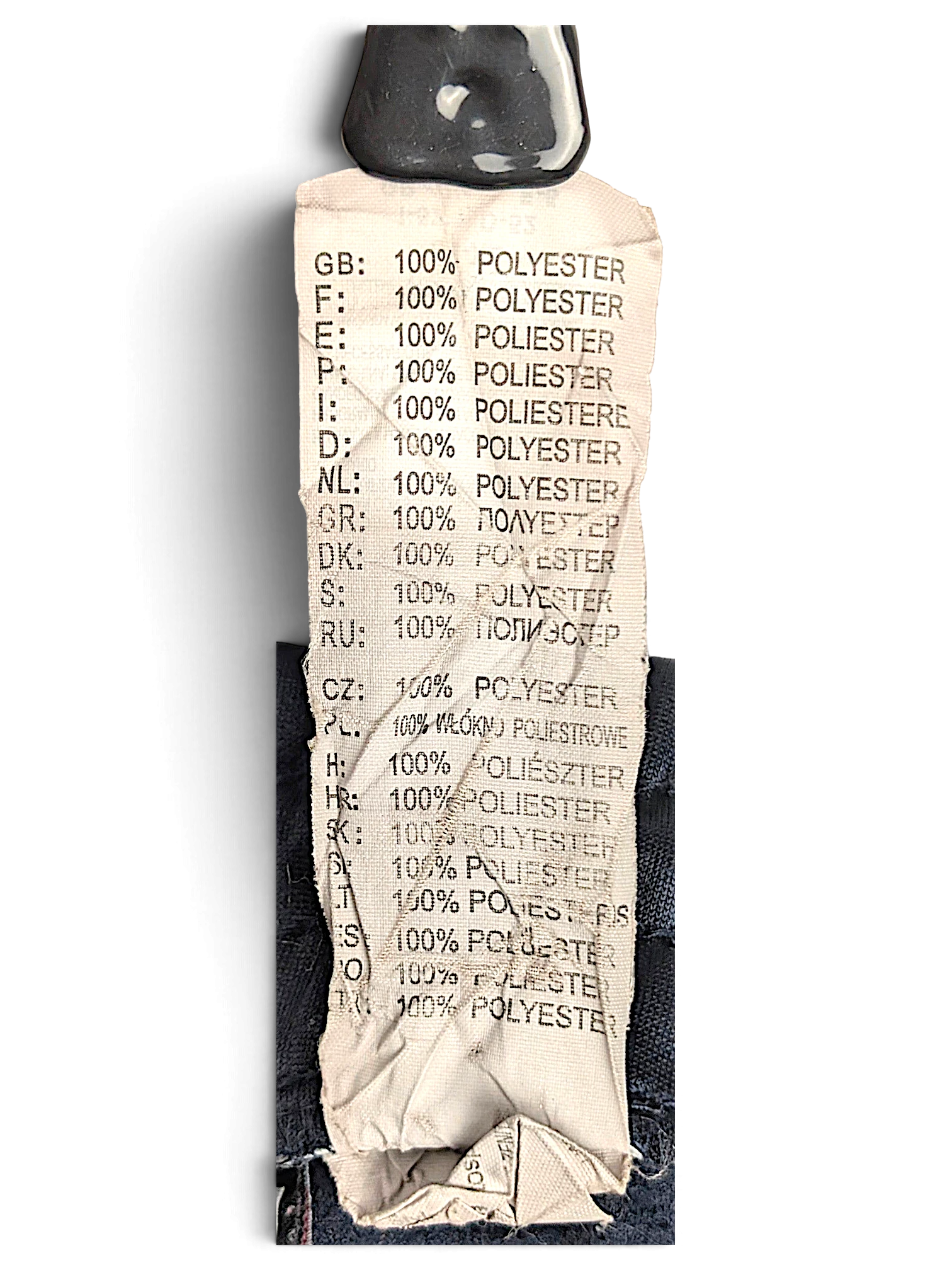JAKE & IPI Lotto track pants care label showing 100 percent polyester composition in multiple languages