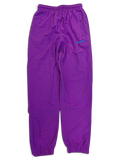 JAKE & IPI pre-owned purple Lotto track pants with elasticated waistband and cuffs in size small.
