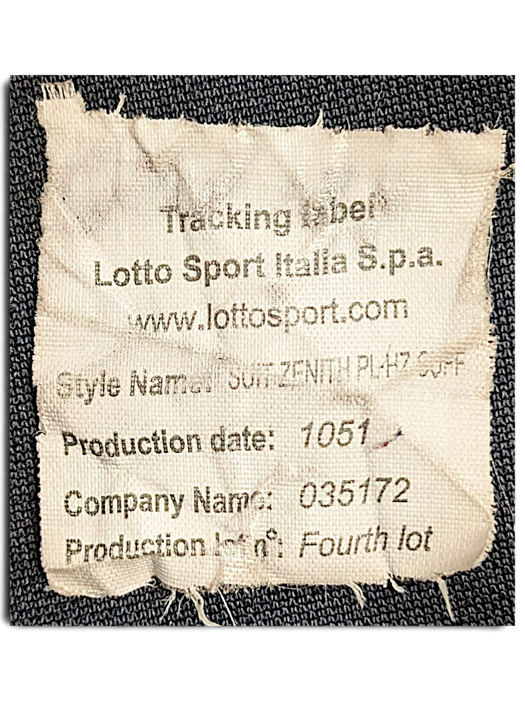JAKE & IPI Lotto brand garment tracking label with production details and style information on navy fabric