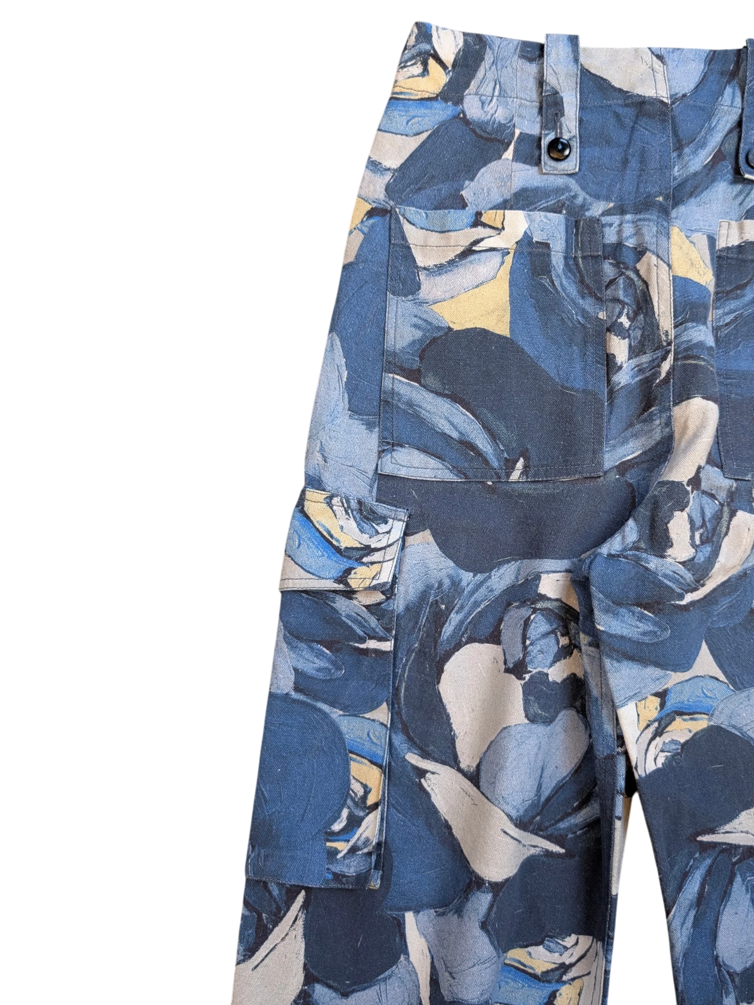 JAKE & IPI Maliparmi blue floral print cargo pants with button flap pockets and adjustable waist tabs.