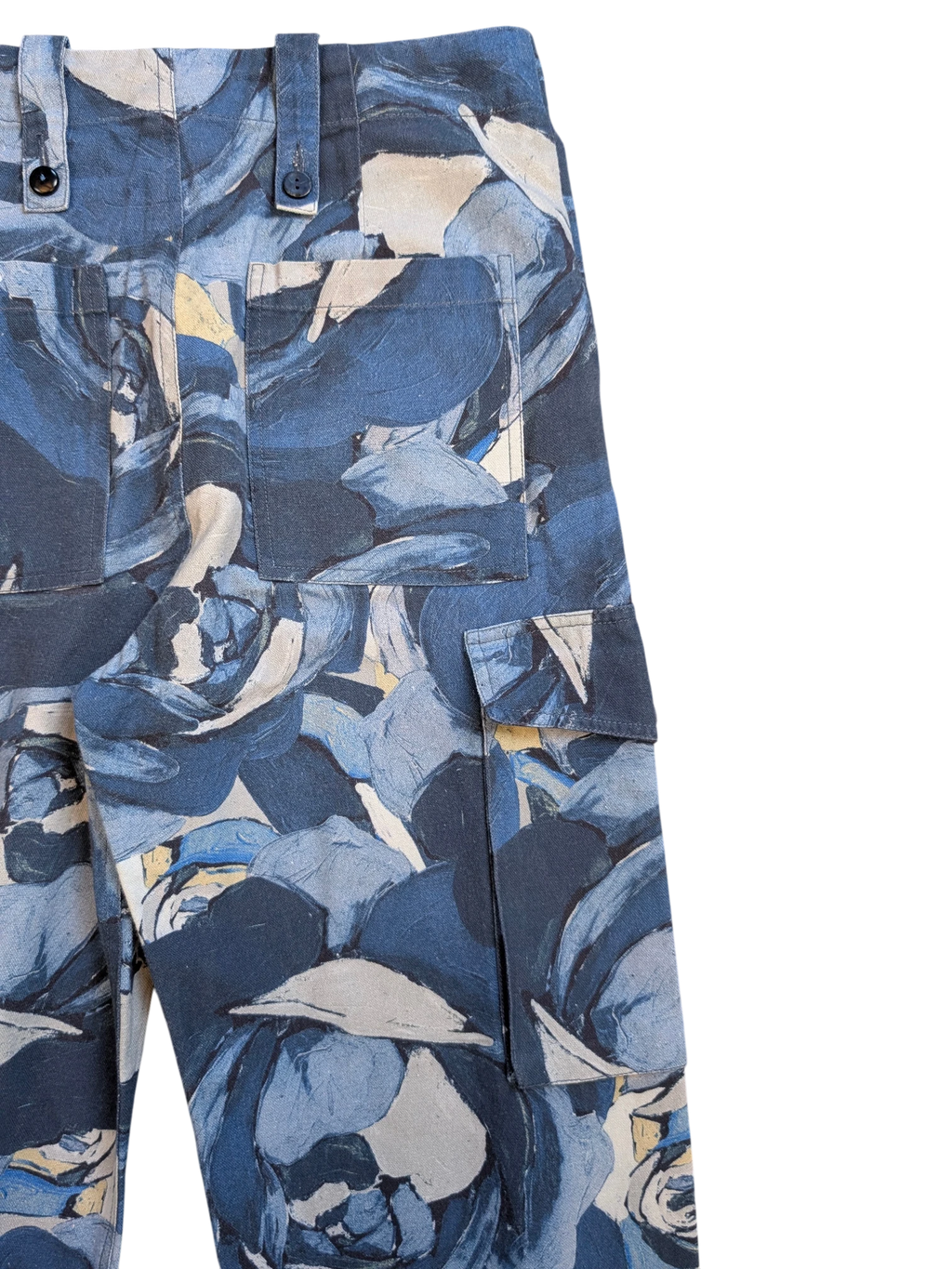 JAKE & IPI Maliparmi blue floral print cargo pants with button flap pockets and adjustable waist tabs.