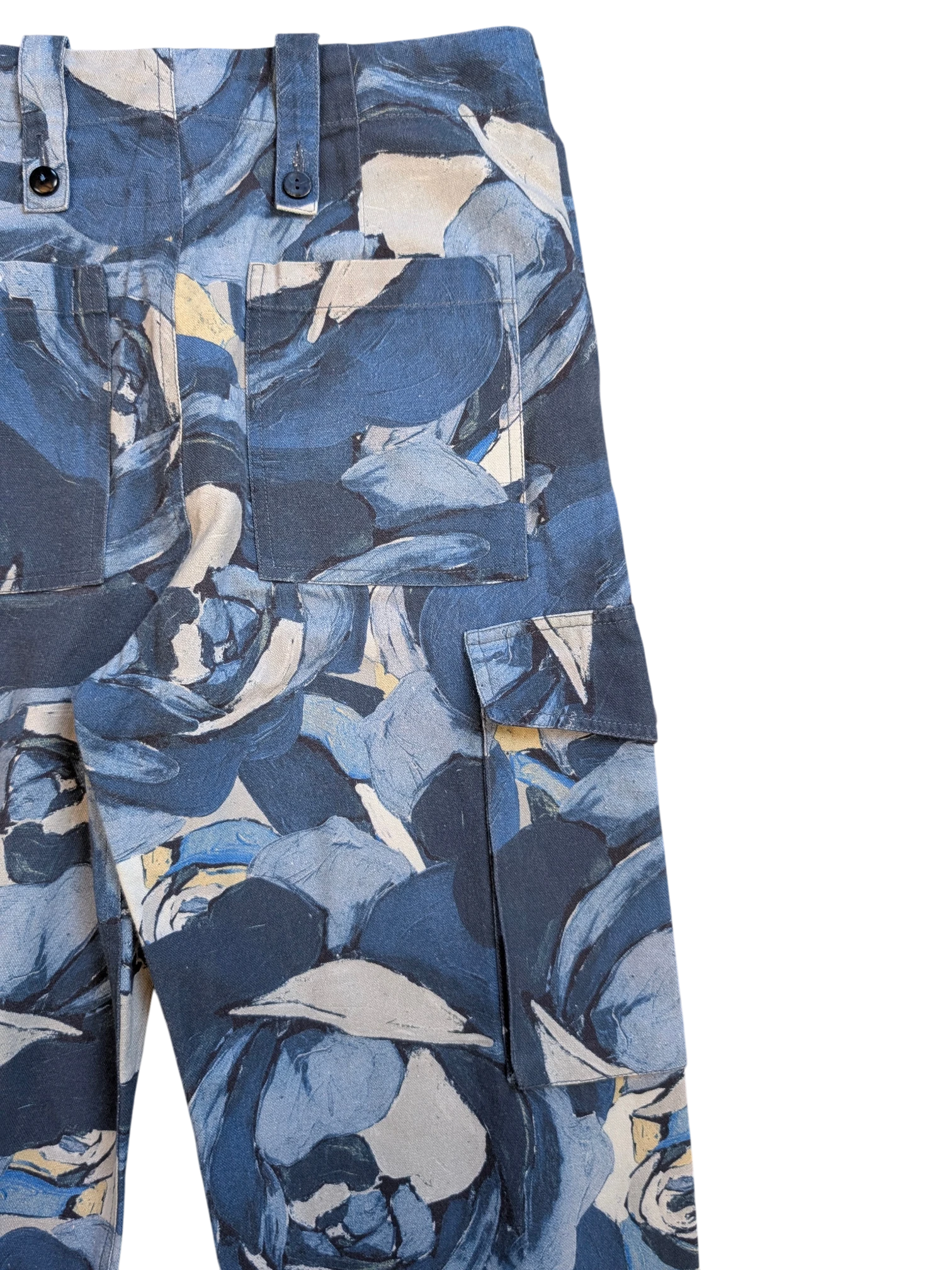 JAKE & IPI Maliparmi blue floral print cargo pants with button flap pockets and adjustable waist tabs.
