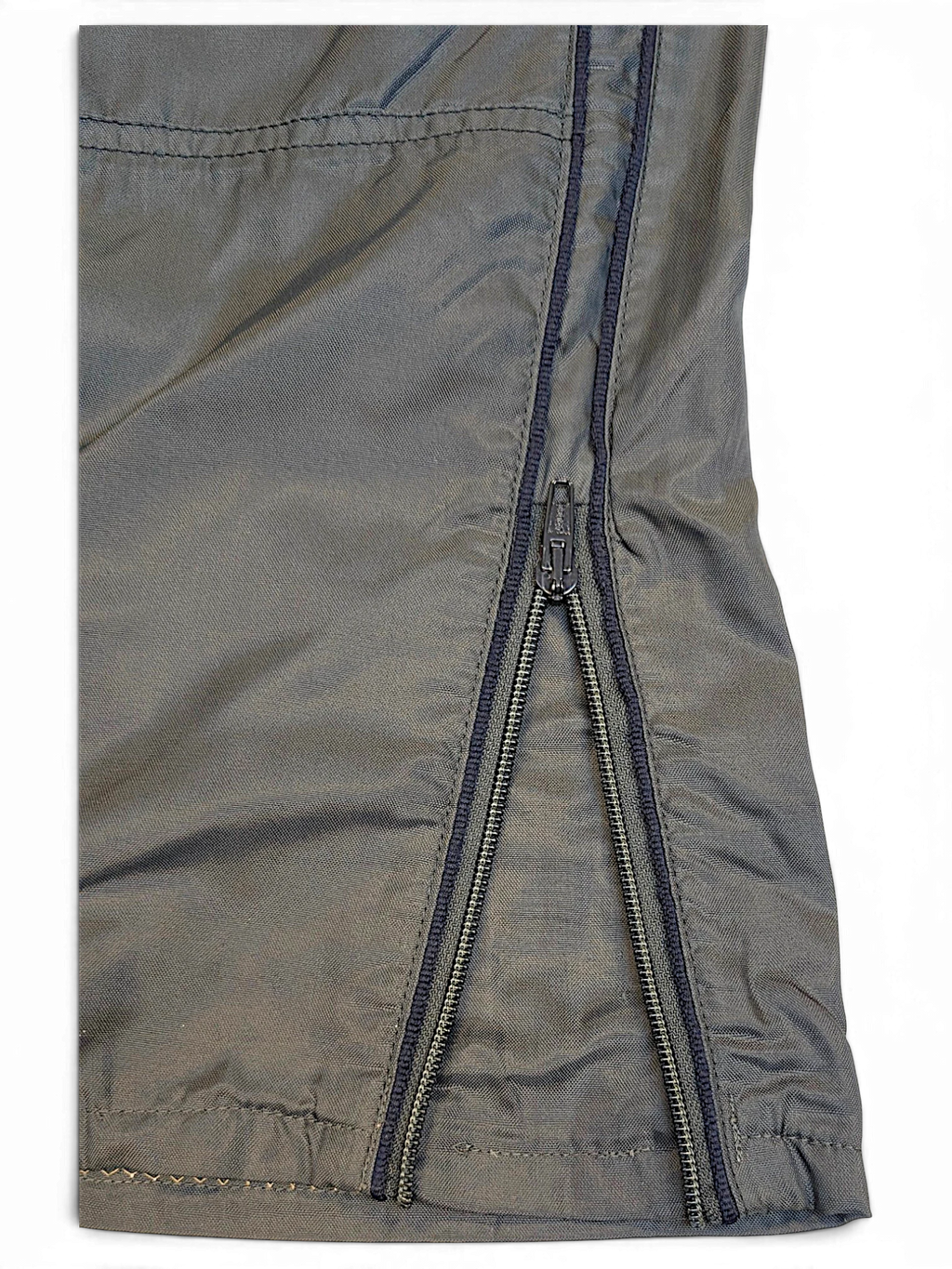 JAKE & IPI Meltin'Pot dark khaki windbreaker pants featuring a lightweight shell and functional zip hem detail.