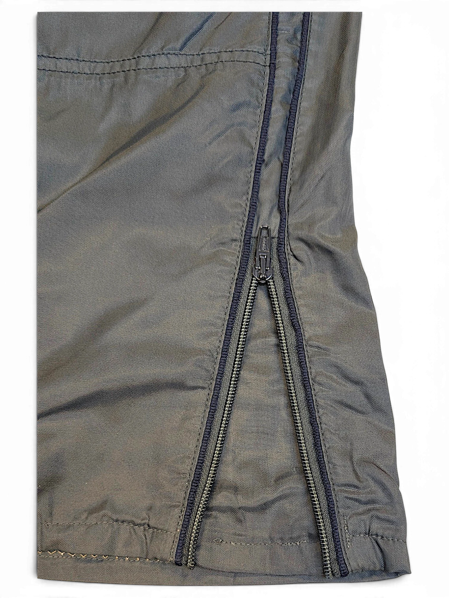 JAKE & IPI Meltin'Pot dark khaki windbreaker pants featuring a lightweight shell and functional zip hem detail.