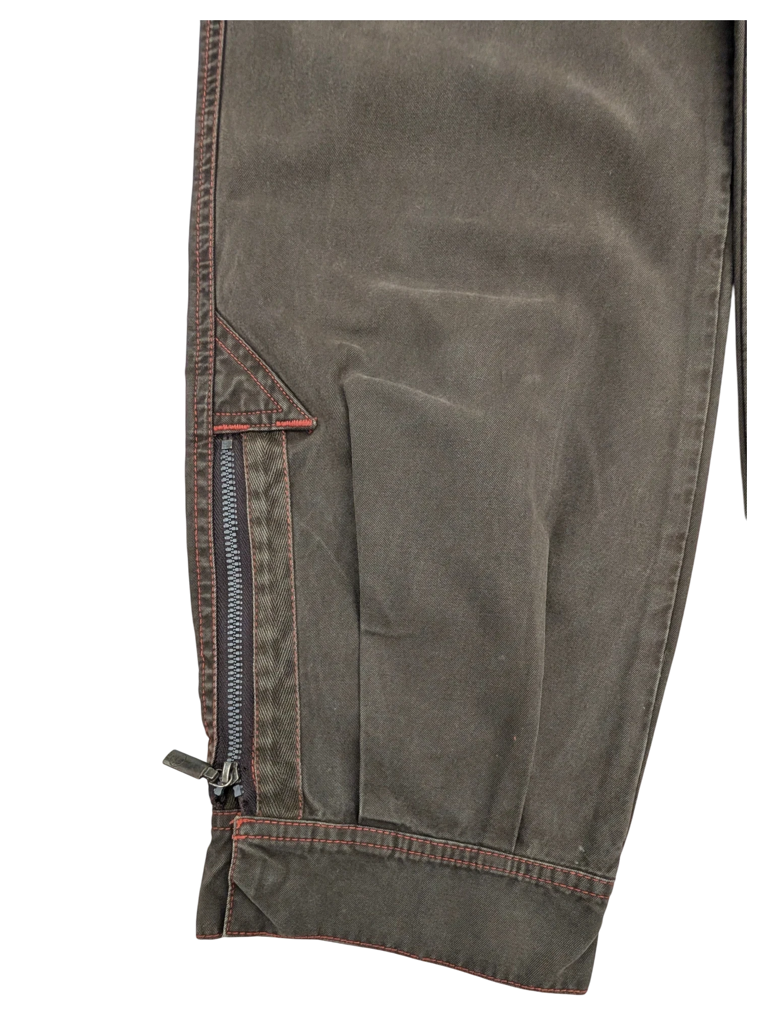 JAKE & IPI Murphy and Nye cargo pants in dark olive green cotton with red stitching and zippered pocket detail.