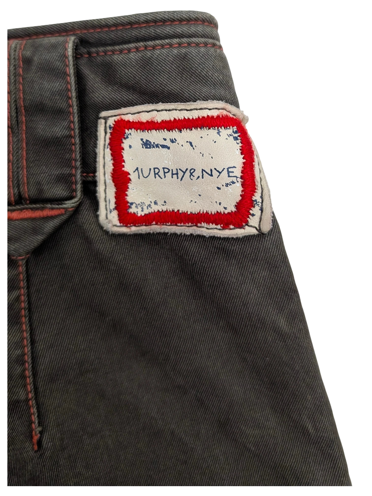 JAKE & IPI Murphy and Nye dark grey denim cargo pants with red contrast stitching and a distressed logo patch.