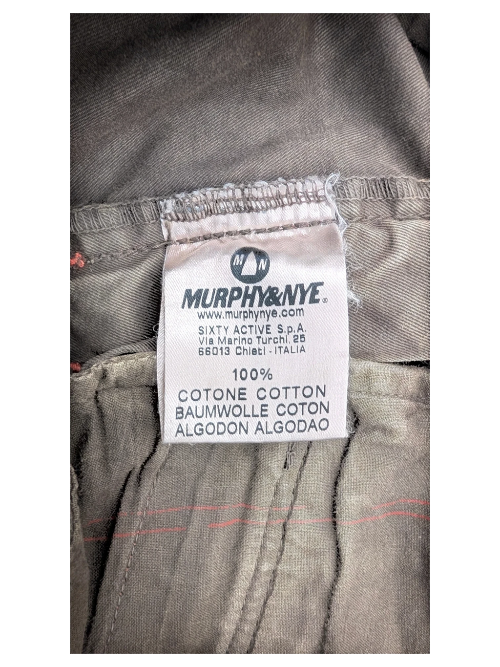 JAKE & IPI Murphy & Nye cargo pants in olive green cotton with subtle red stitching detail.