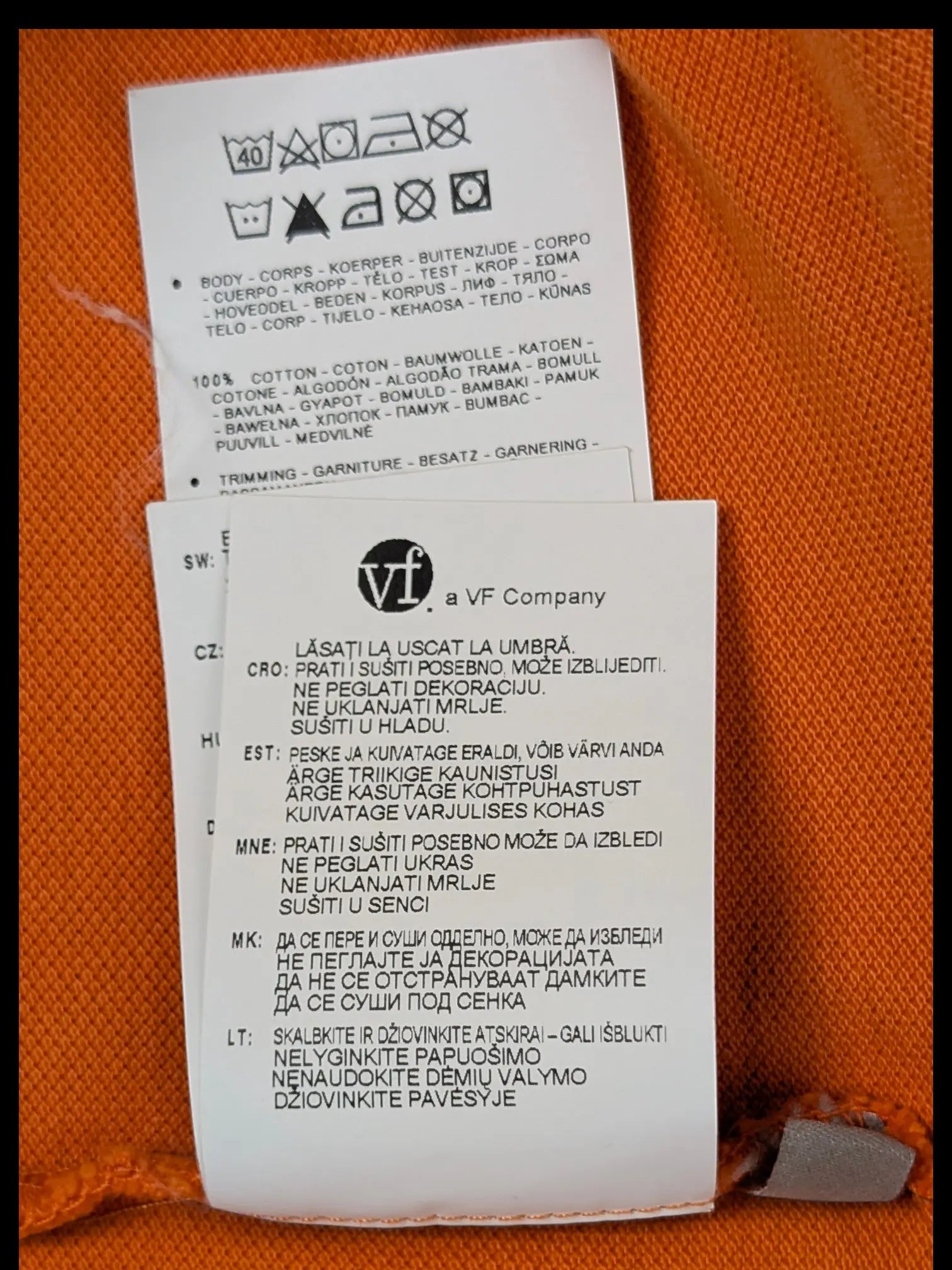 JAKE & IPI Napapijri orange polo shirt interior care label with cotton material and washing instructions