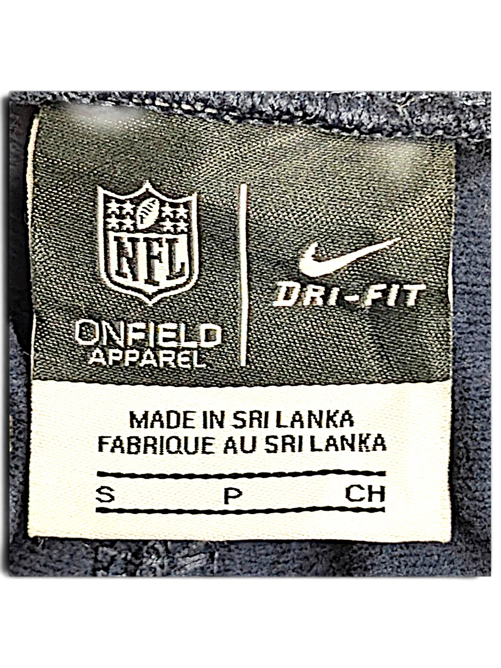 JAKE & IPI Nike NFL Dri-FIT track pants size S clothing label showing branding and origin