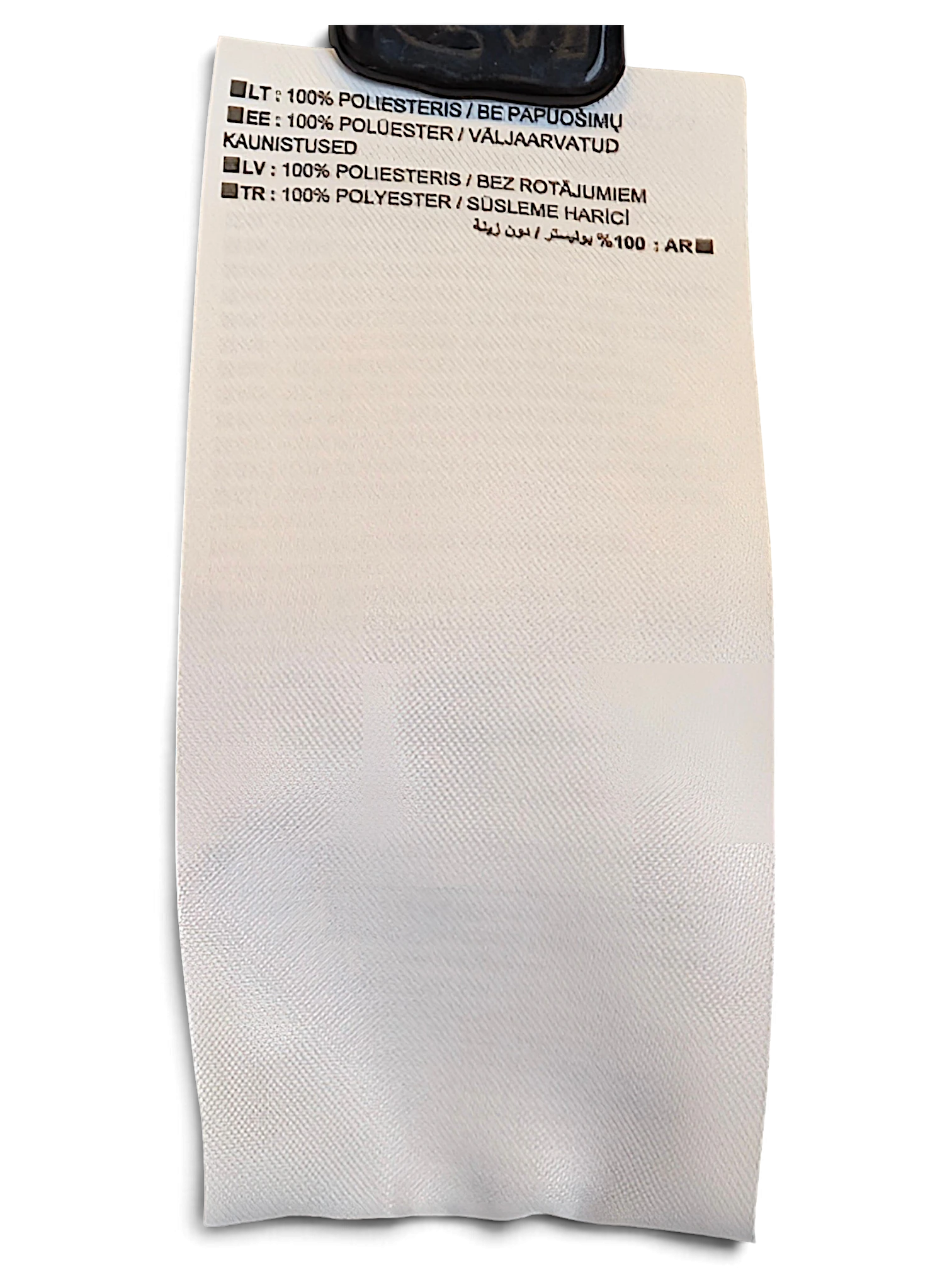 JAKE & IPI Nike track pants care label showing 100% polyester composition in multiple languages