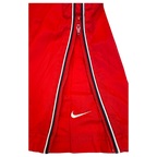 JAKE & IPI Nike red track pants featuring a black and white side stripe with a white embroidered Swoosh logo