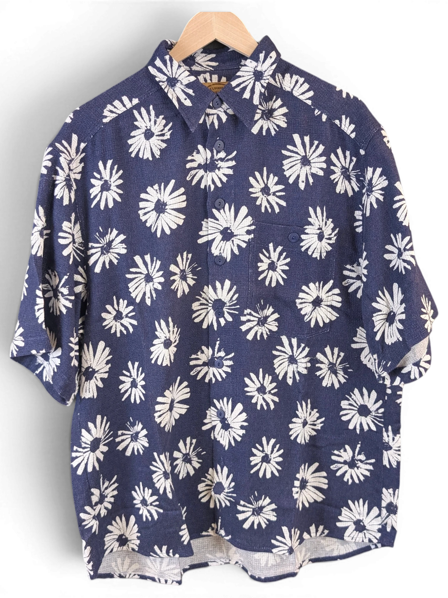 JAKE & IPI Olymp deadstock Hawaiian shirt in navy blue with a white daisy floral print and button-up front.