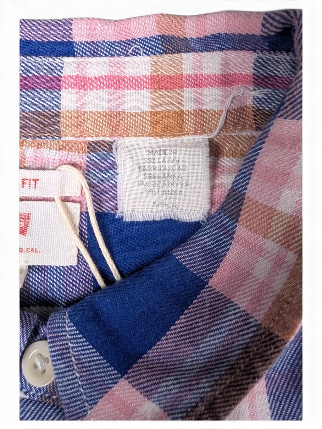 JAKE & IPI vintage plaid long sleeve shirt in blue, pink, and beige with a raw hem and snap chest pockets.