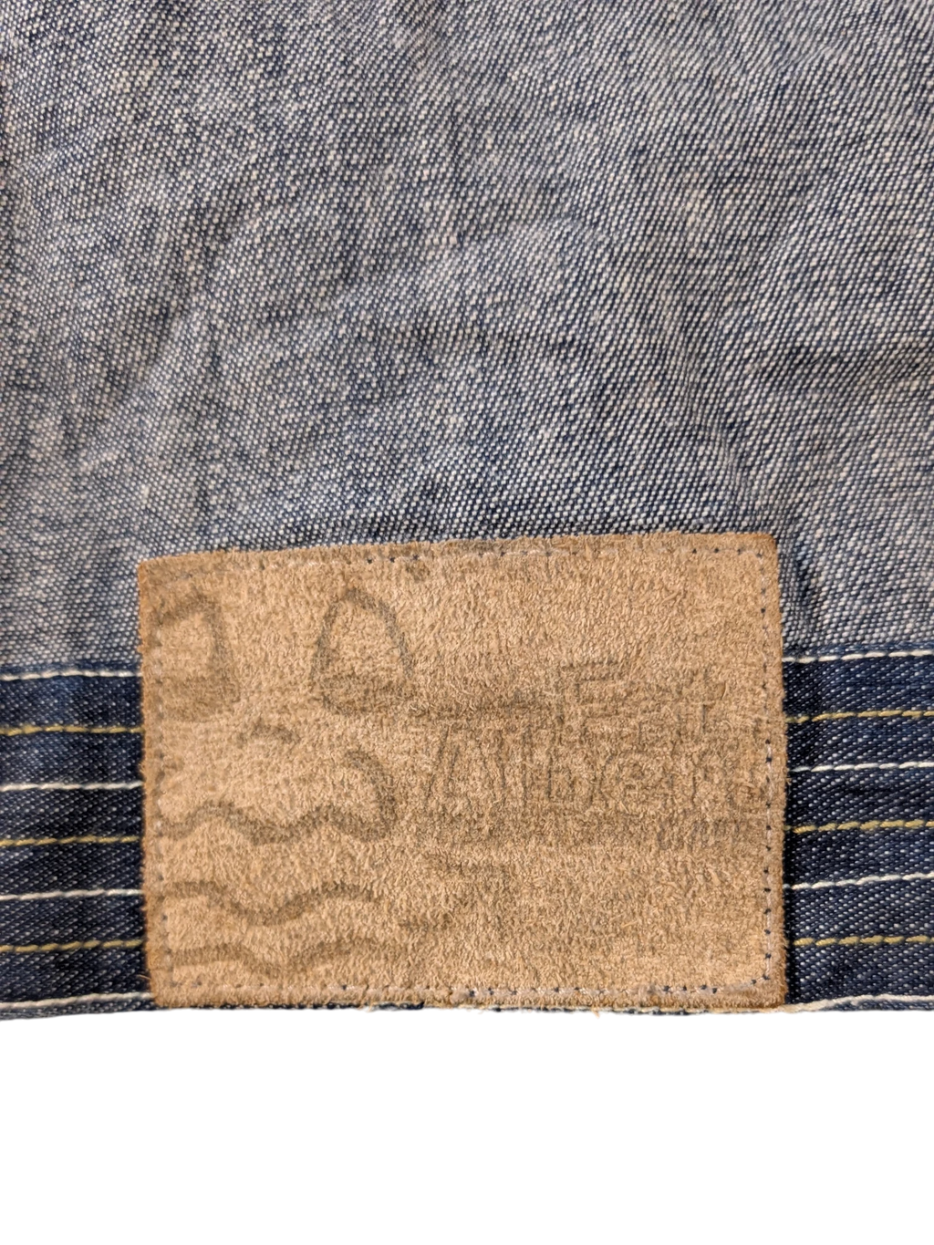 JAKE & IPI Platinum FUBU denim jacket with a tan suede patch detail.