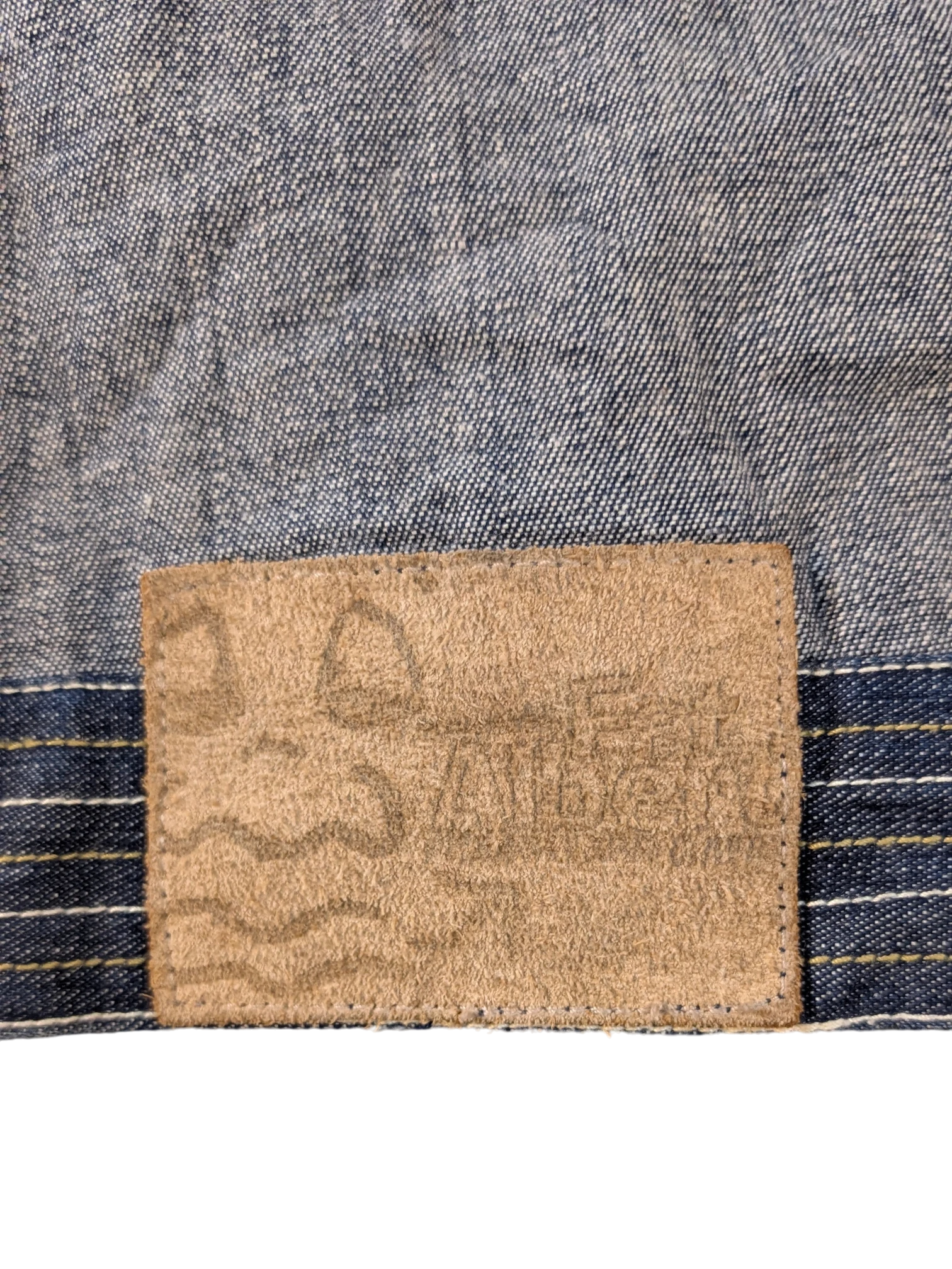 JAKE & IPI Platinum FUBU denim jacket with a tan suede patch detail.