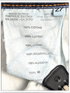JAKE & IPI Prada blue jeans care label showing 100% cotton composition and Made in Italy origin