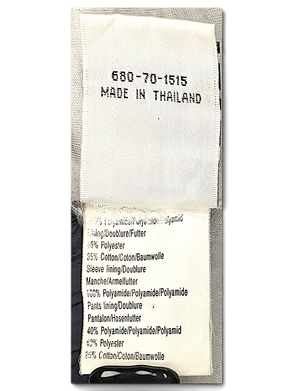 JAKE & IPI Puma track pants fabric composition and care label showing material breakdown and origin
