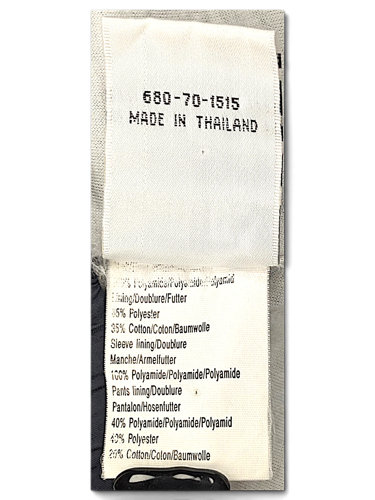 JAKE & IPI Puma track pants fabric composition and care label showing material breakdown and origin