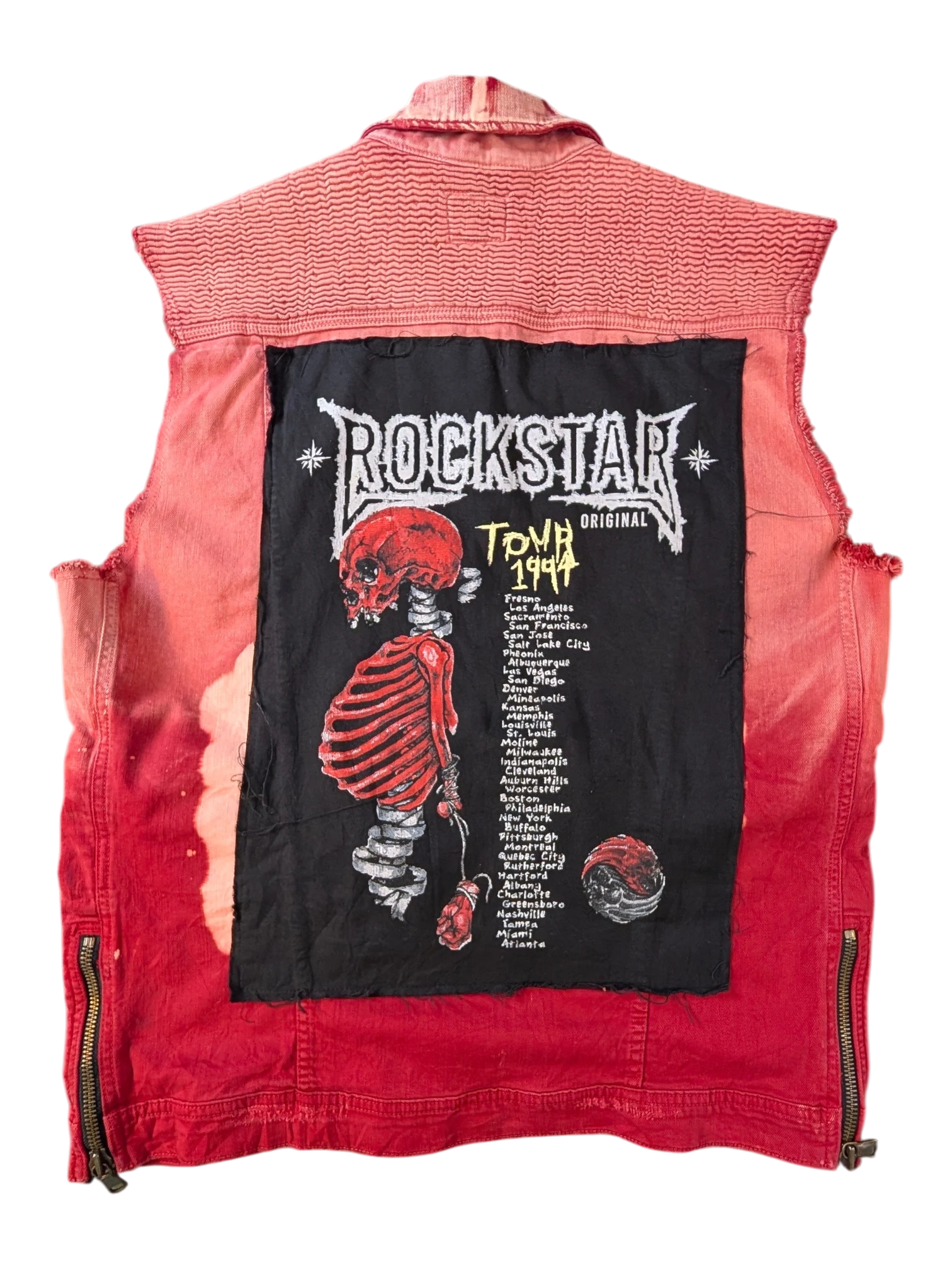 JAKE & IPI Rockstar original denim vest with red tie-dye wash and a large black patch featuring a skeleton graphic and tour dates.