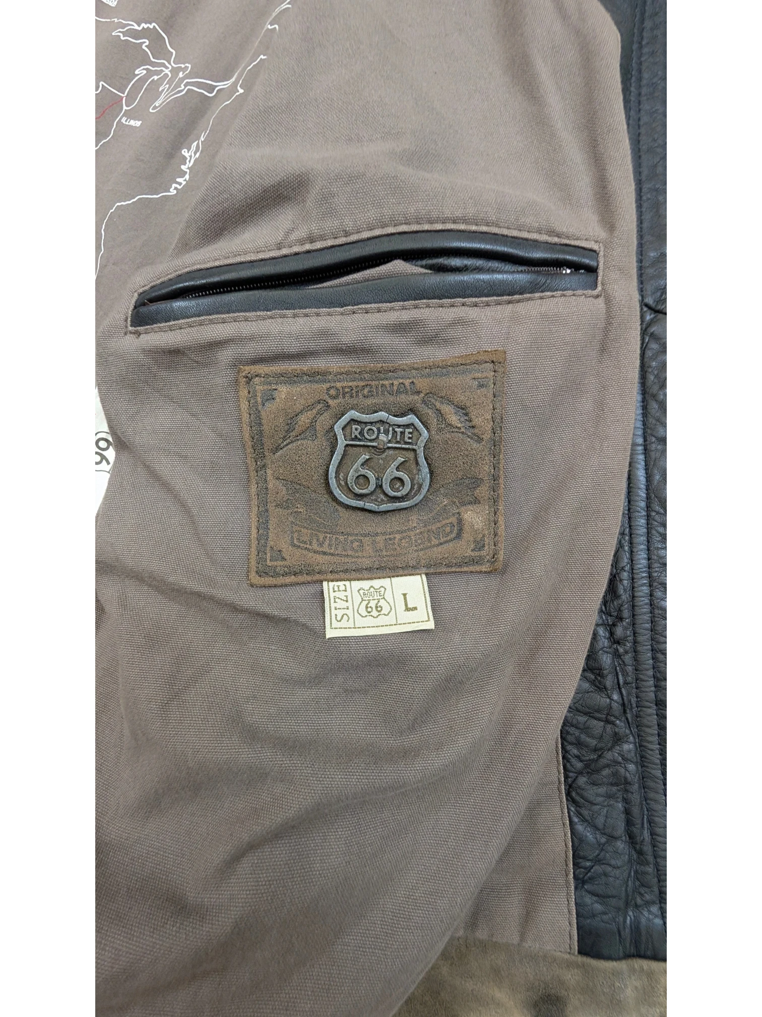 JAKE & IPI Route 66 leather jacket with brown lining and a map of the US. Features a leather patch with Route 66 logo and size L tag.