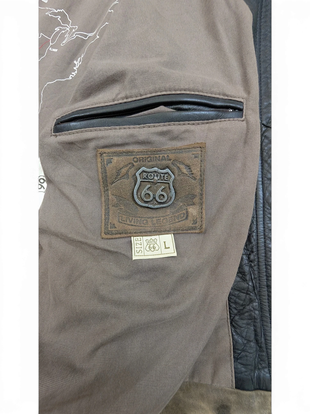 JAKE & IPI Route 66 leather jacket with brown lining and a map of the US. Features a leather patch with Route 66 logo and size L tag.