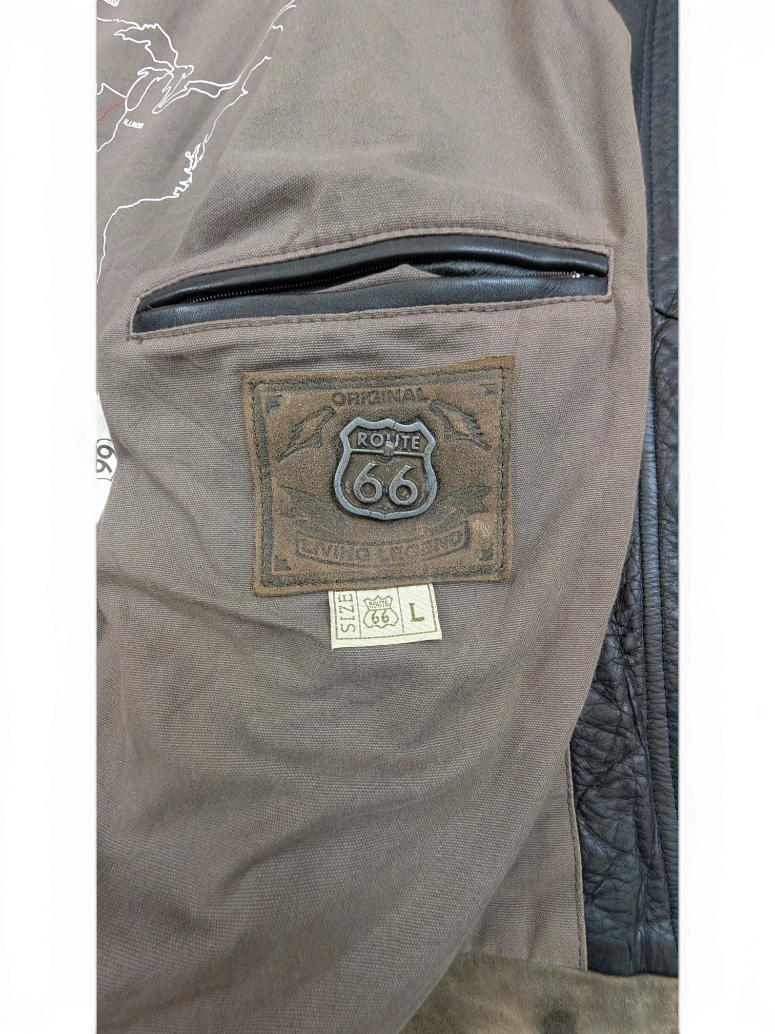JAKE & IPI Route 66 leather jacket with brown lining and a map of the US. Features a leather patch with Route 66 logo and size L tag.