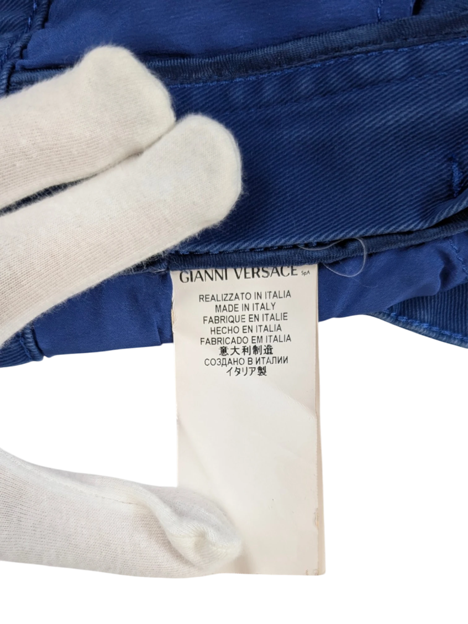 JAKE & IPI vintage royal blue stretch cotton mini skirt with gold Medusa hardware and embroidered back pocket detail.