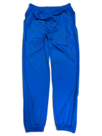 JAKE & IPI pre-owned Rucanor royal blue track pants with elastic waist and retro sportswear styling.