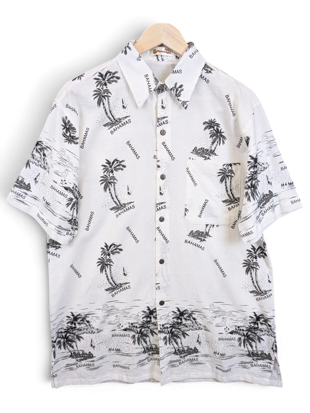 JAKE & IPI Shoreline Hawaiian shirt in white with black palm tree and Bahamas beach print, featuring a chest pocket.
